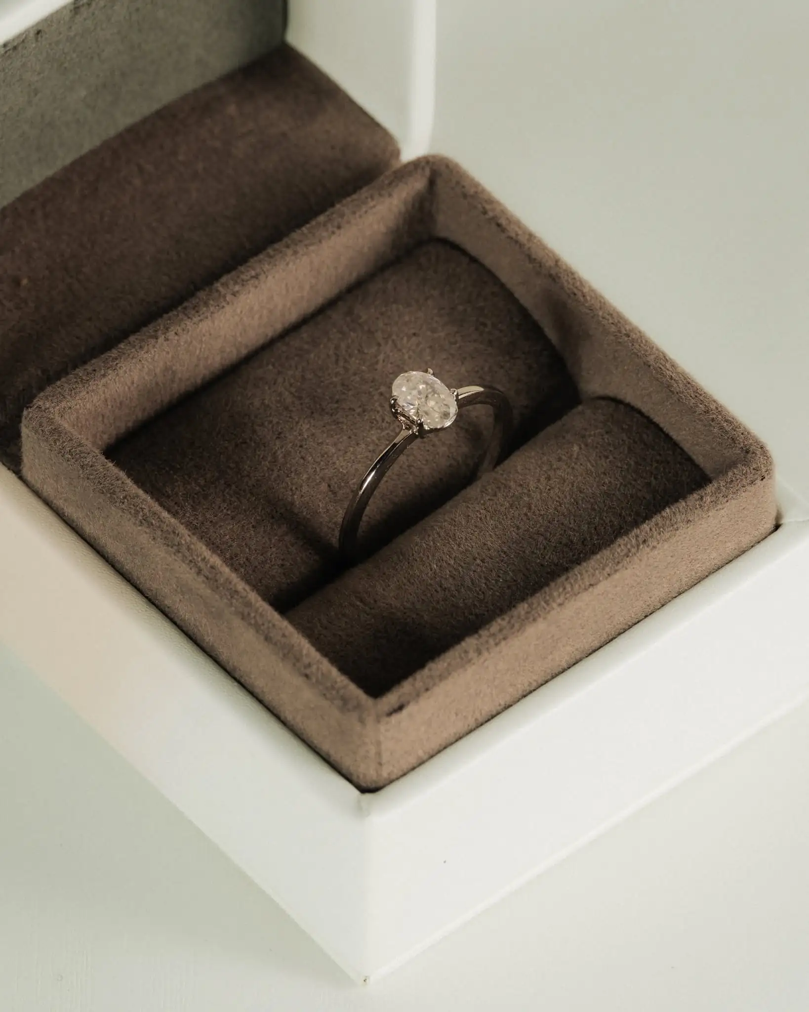 An oval solitaire seated in its presentation box