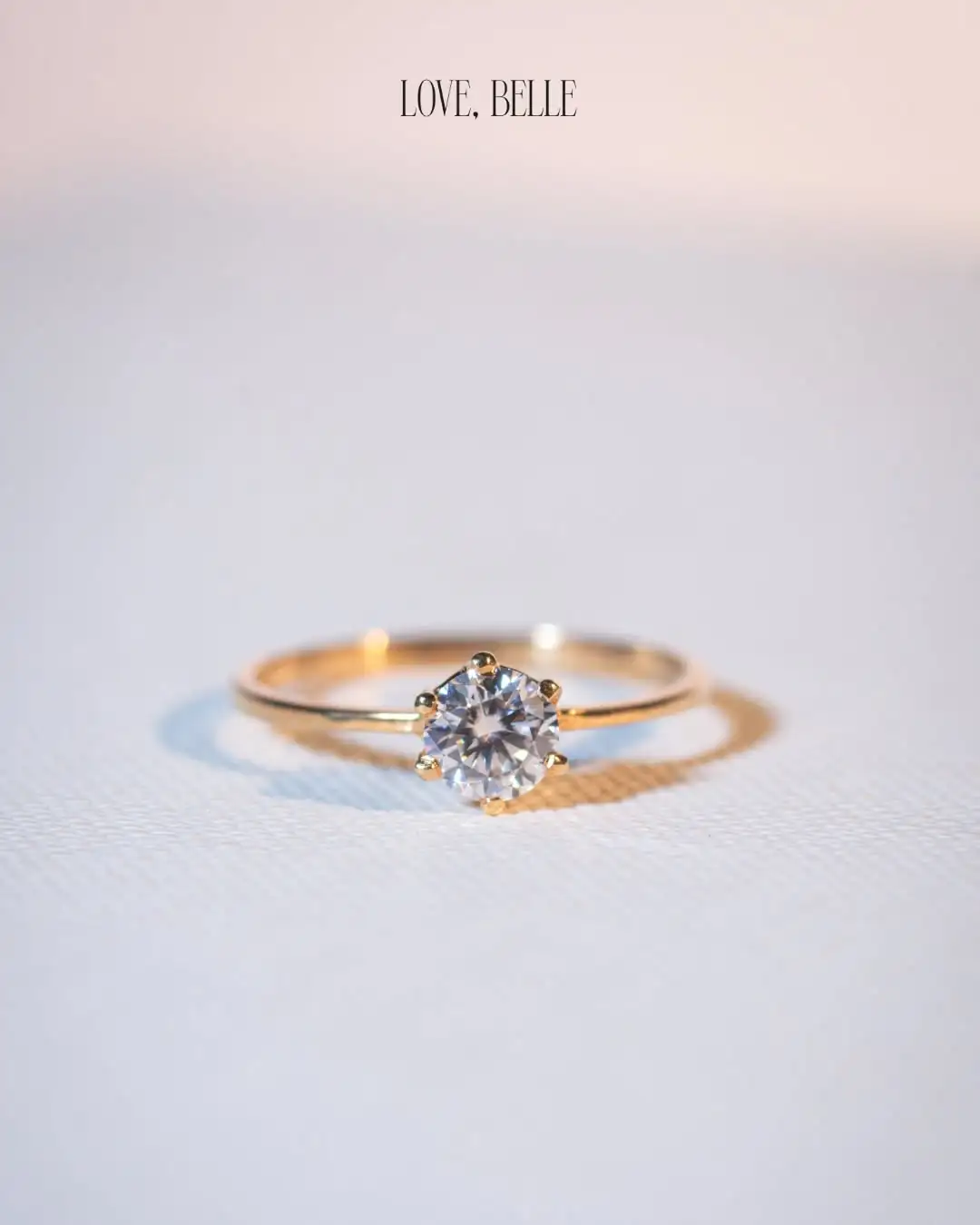 A delicate solid gold Love, Belle solitaire